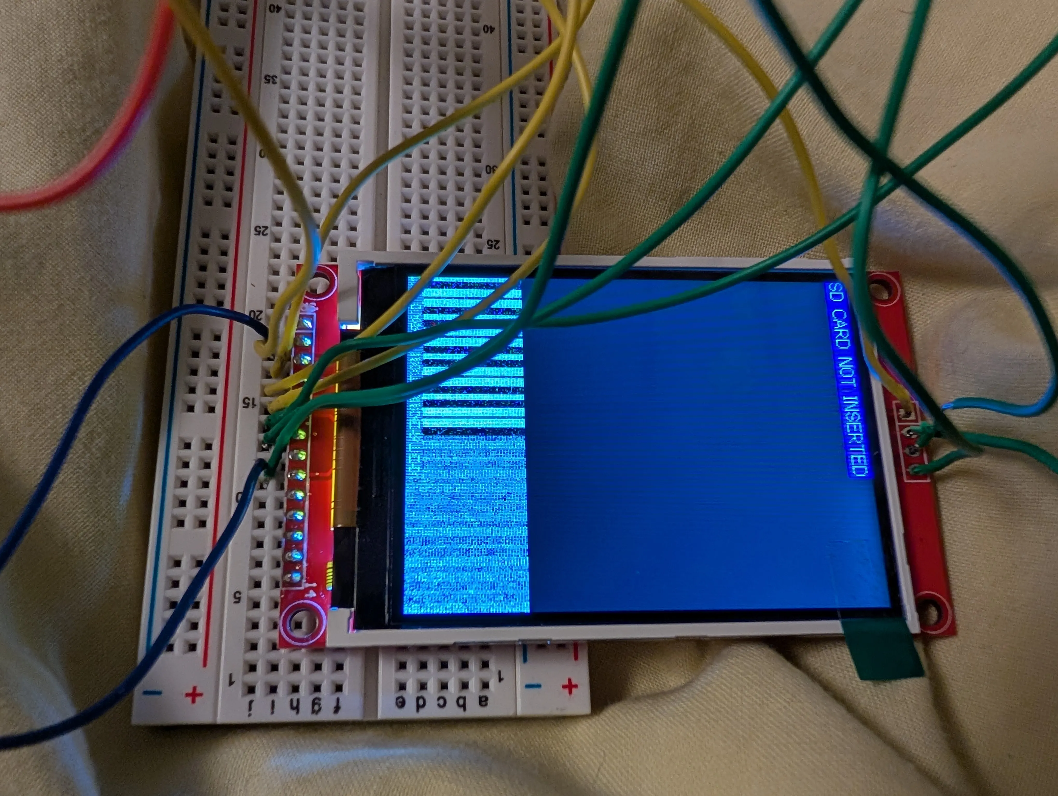 SD card wires are placed into the holes unsoldered